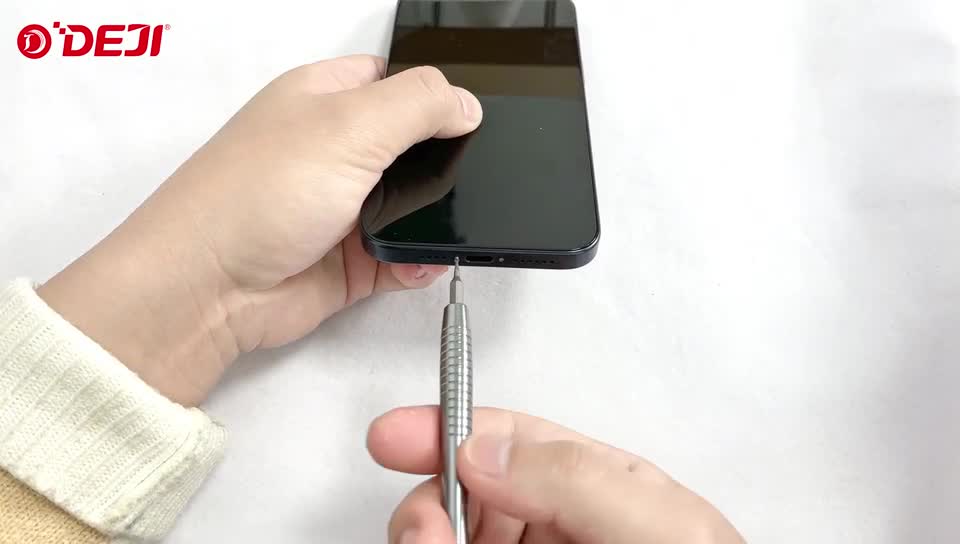 Unscrewing the two pentalobe screws next to the charging port