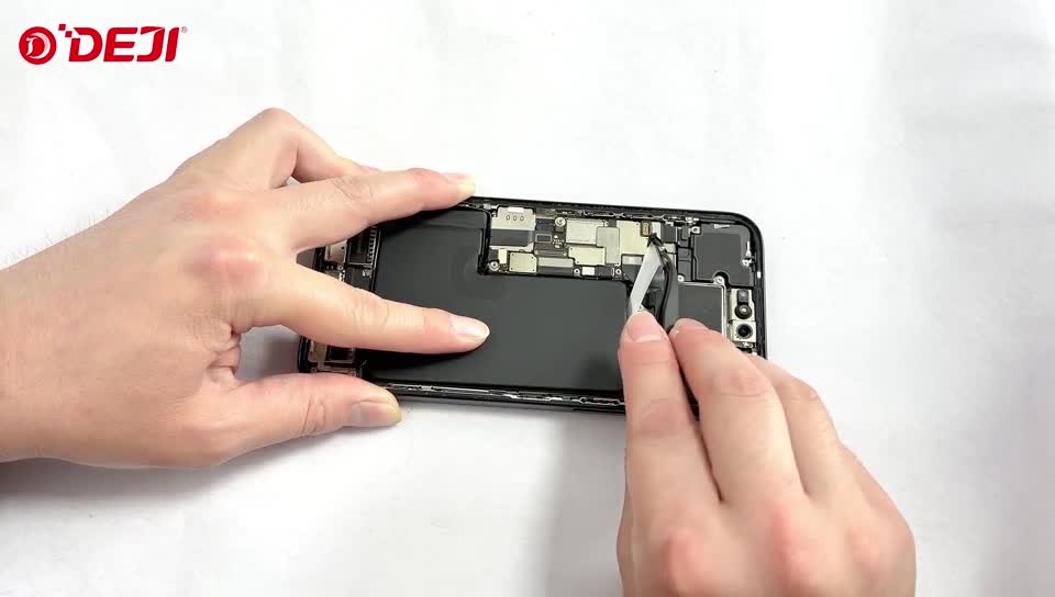 Pulling battery adhesive strips from under the battery